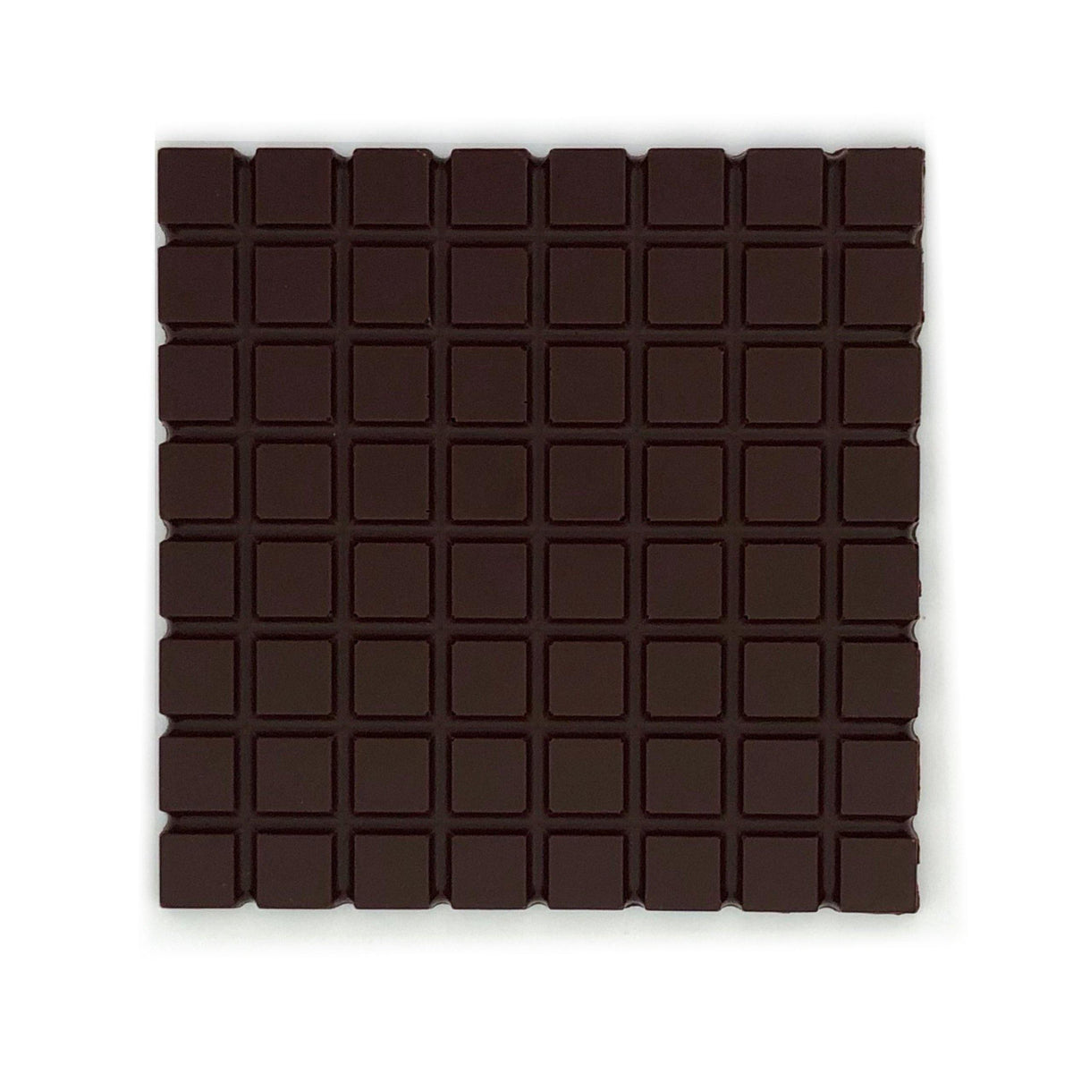 Square block of extra dark chocolate with 85% cocoa content, perfect for rich flavors and organic indulgence.