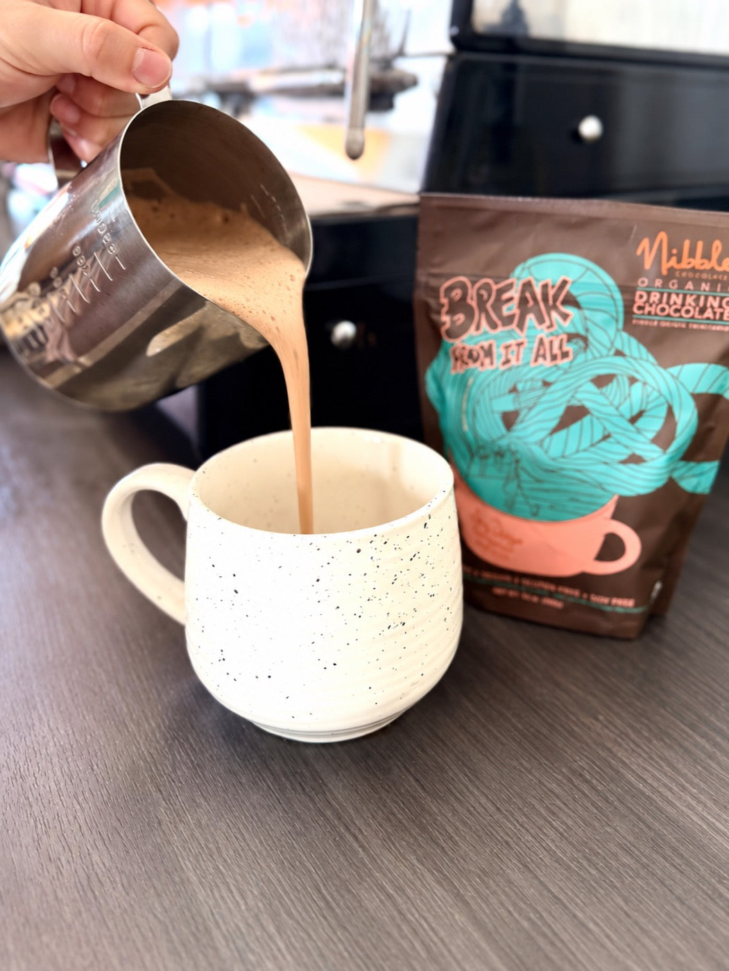 Hot chocolate poured into a ceramic mug